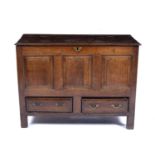 Oak mule chest circa 1800, with lift up top and fitted with two drawers to the base, 122cm wide x