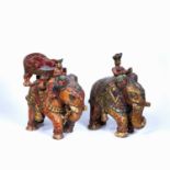 Two carved Indian models 20th Century, of elephants and mahouts, with polychrome painted decoration,