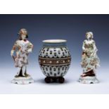 Pair of Volkstedt porcelain figures of a lady and gentleman in fine dress, decorated with flowers,