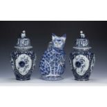 Pair of Delft lidded baluster vases blue and white floral decoration, marked 'Delft' to the base,
