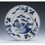 Delft blue and white pottery plate 18th Century, painted with a Chinese fence pattern, and foliate