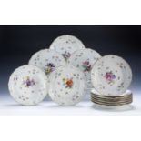 Set of twelve Meissen porcelain shallow bowls German, each individually painted with flower sprays