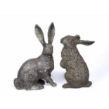 Two cast metal sculptures of rabbits both seated, unsigned, one measures 33cm high, the other