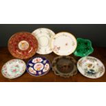 A collection of decorative plates comprising a Spode stone china floral decorated plate, 21cm