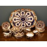 A Royal Crown Derby imari pattern teaset to include a teapot, sugar bowl, milk jug, four teacups and