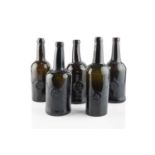 A group of five sealed wine bottles, cylinders, three stamped A.S.C.R. (All Souls Common Room) and
