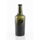 A sealed wine bottle, cylinder, seal stamped with a hand and initials H.C. (Henry Carew), 26cm