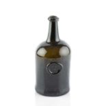 A sealed wine bottle, squat cylinder, seal stamped IBB (John Braddon, Bridgerule, Devon), 23cm high