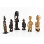 An old African wood figure carved in the form of a man with beaded girdle and cotton loin cloth,