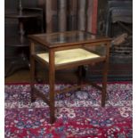 An Edwardian mahogany display table, with hinged and glazed top on square section supports, 62 x