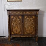 A 19th century Dutch mahogany and marquetry side cupboard, having a drawer above a pair of doors,