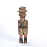 A West African, Nigerian, colonial statue, carved painted wood of an officer in military dress, 38cm