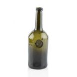 A sealed wine bottle, cylinder, seal stamped W.A. (William Assheton, Downhan Hall), 27cm high