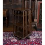 An Edwardian oak revolving bookcase, with gadrooned top and slatted sides, 54.5cm wide Provenance: