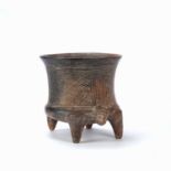 A Pre-Columbian, Comala style, pottery bowl, rasied by a four legged creature. body decorated with