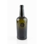 A sealed wine bottle, cylinder, seal stamped A Kelly (Arthur Kelly of Kelly, Devon), 26.5cm high