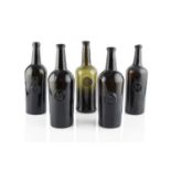A group of five sealed wine bottles, cylinders, each seal stamped A.S.C.R. (All Souls Common
