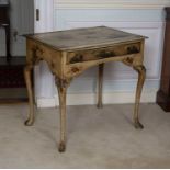 An early 20th century Japanned lowboy decorated with Chinoiserie scenes on a cream coloured