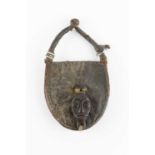 A Fang, Gabon, witch doctor's hide purse, each side applied with mask head, leather stap handle,