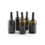 A group of five sealed wine bottles, cylinders, three stamped A.S.C.R. (All Souls Common Room) and