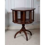 An Edwardian mahogany and satinwood banded octagonal book stand, with spindle turned divisions, on