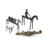 A group of four cast metal sculptures of the Dhokra Damar, West Bengal, including a man on
