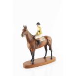 A Beswick figure of the racehorse Arkle, with jockey Pat Taaffe up, on oval wooden plinth base, 32.