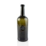 A sealed and dated wine bottle, cylinder, seal stamped R.H.C. 1815 (Richard Hall Clarke), 28cm high