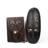 A large oceanic ancestor mask from Papua New Guinea, carved wood with cowrie eyes, 81cm long,