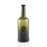 A sealed wine bottle, cylinder, seal stamped with a griffin, 27cm high Provenance: Harveys Wine