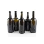 A group of five sealed wine bottles, cylinders, two stamped A.S.C.R. (All Souls Common Room) and