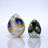 Pauline Solven (b.1943) two studio glass paperweights, the yellow and blue example signed and