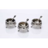 Set of three Victorian silver salts with matched spoons with lion mask decoration, bearing marks for