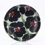 Janice Tchalenko (1942-2018) at Dartington Pottery studio pottery plated, decorated with flowers,
