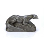 Richard Fisher (Contemporary) Model of an otter with pewter finish, signed near the base, 26cm
