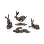 Paul Jenkins (b.1949) Four bronze models of hares the running hare is signed near the base, 9.5cm