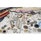 Large collection of costume jewellery to include: silver ingot necklace, simulated pearls, rolled