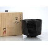 Shinichi Honma (b.1948) Japanese studio pottery, black raku tea bowl, incised signature to the base,