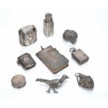 Collection of silver and white metal to include: a tall silver scent bottle, bearing marks for