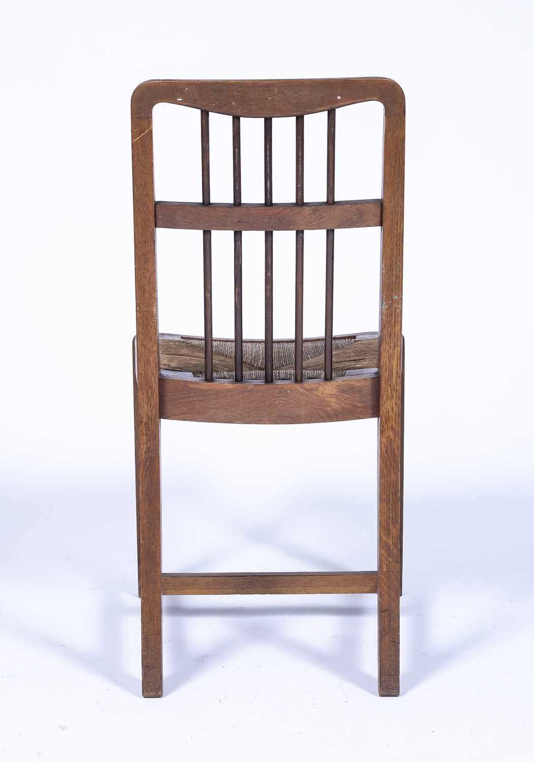 Arts & Crafts oak framed chair with spindle back and drop-in raffia seat, unmarked, 85cm - Image 2 of 2
