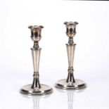 Pair of silver candlesticks filled, with knopped stems, bearing marks for W I Broadway & Co,