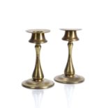 Secessionist style Pair of brass candlesticks, stamped with shields to the base, 12.5cm high (2)