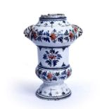 An Italian maiolica pottery drug jar of double baluster form, lion head mounts and red and blue