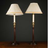A pair of Georgian style mahogany table lamps with gilt metal candle sconce on mahogany pillar and