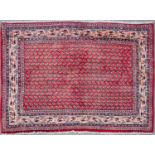 A Middle Eastern Persian style Araak red ground rug 145cm x 110cmCondition report: In good