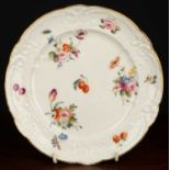 A 19th century Nantgarw porcelain plate, hand decorated with floral and fruit sprays and insects