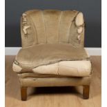 An art deco upholstered low armchair with four square feet and horsehair and feather filling, 72cm