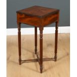 A George IV lamp table with single frieze drawer and reeded legs united by an X stretcher, the top