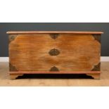 An Oriental large elm chest with pierced brass mounts and central Dutch East India Company motif