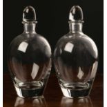 A pair of Orrefors decanters both inscribed to the bottom, 17.5cm high (2)Condition report: Some